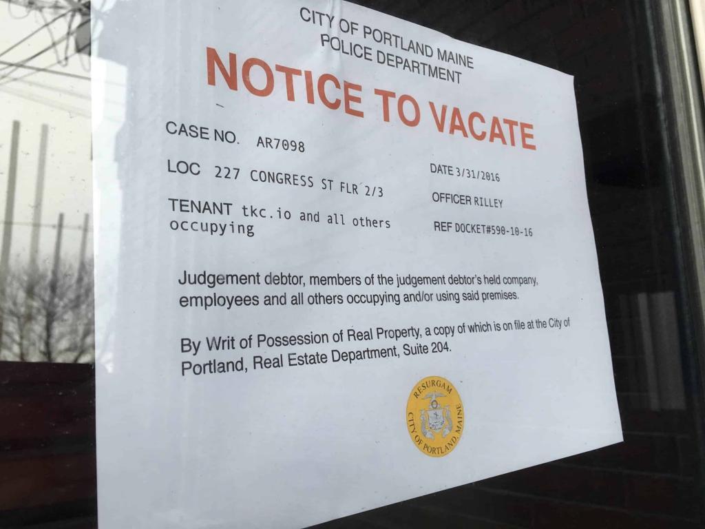 Pretend eviction notice sign hanging in door
