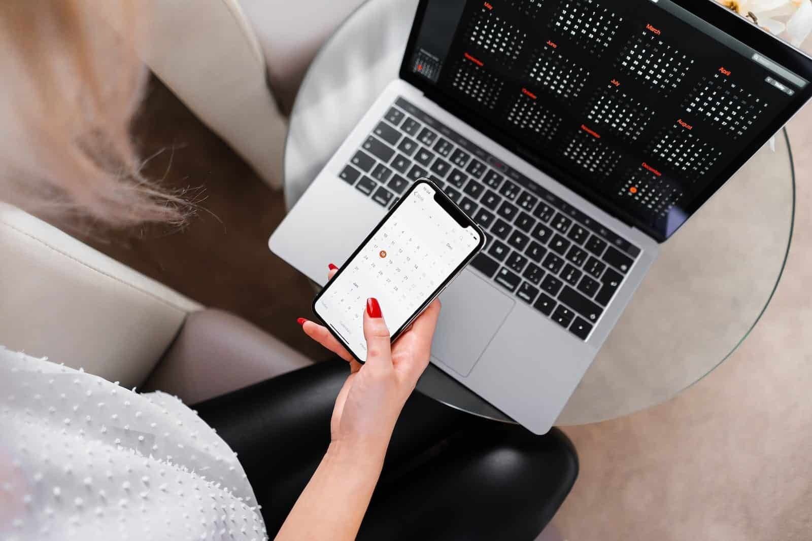 Woman with laptop and phone